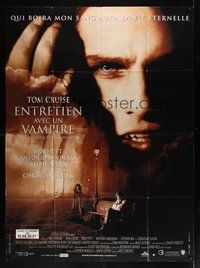 7h487 INTERVIEW WITH THE VAMPIRE French 1p '94 close up of fanged Tom Cruise, Brad Pitt, Anne Rice
