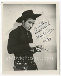 7y067 LASH LA RUE signed 8x10 REPRO still '83 waist-high cowboy portrait loading his gun!