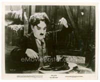 8w318 GOLD RUSH 8x10 still R41 classic image of Charlie Chaplin eating spaghetti shoe laces!