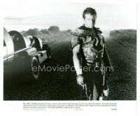 8w464 MAD MAX 2: THE ROAD WARRIOR 7.5x9.25 still '82 Mel Gibson as Mad Max standing by his car!