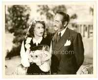 8w737 YOU WERE NEVER LOVELIER 8x10 still '42 Menjou smiles at beautiful Rita Hayworth with orchid!