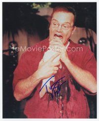 9a093 TOM ARNOLD signed color 8x10 REPRO still '02 wacky c/u putting a whole fish in his mouth!