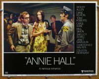 9b123 ANNIE HALL LC #6 '77 Woody Allen & Shelley Duvall stopped by security guard!