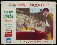 9b725 TO CATCH A THIEF Spanish/U.S. LC '55 Cary Grant looks at Grace Kelly in convertible, Hitchcock!