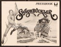9g375 SWASHBUCKLER pressbook '76 art of pirate Robert Shaw swinging on rope by ship!