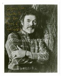 9k093 RUSS TAMBLYN signed 8x10 REPRO still '92 close up posing by a tree with his arms crossed!
