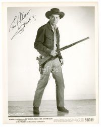 9w126 GUY MADISON signed 8x10 still '56 full-length standing & holding rifle from Reprisal!
