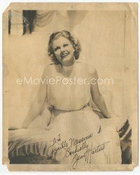 9w086 JEAN HARLOW signed deluxe 8x10 still '30s wonderful smiling portrait seated on bed!