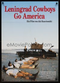 1k038 LENINGRAD COWBOYS GO AMERICA German '89 great wacky image of band on beach w/black Cadillac!