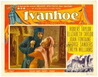 2j414 IVANHOE LC #3 '52 close up of Robert Taylor in armor grabbing pretty Joan Fontaine!