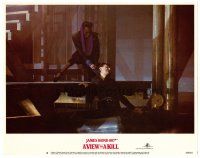 2j908 VIEW TO A KILL LC #8 '85 James Bond, close up of Grace Jones dragging unconscious man!