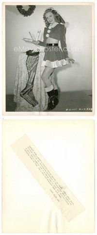 2k418 JANET BLAIR 8.25x10 still '44 in sexiest Christmas outfit putting war bonds in stocking!