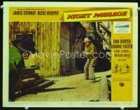 3h594 NIGHT PASSAGE LC #2 '57 James Stewart holds Dan Duryea at gunpoint in street!