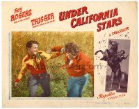 3h835 UNDER CALIFORNIA STARS LC #4 '48 Roy Rogers in close up fight with bad guy!