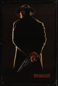 3y856 UNFORGIVEN undated teaser 1sh '92 image of gunslinger Clint Eastwood with his back turned!