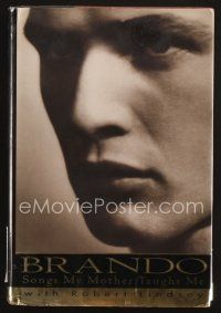 3z181 MARLON BRANDO signed hardcover book & paper '94 his autobiography, Songs My Mother Taught Me!