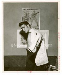 4h217 ELVIS PRESLEY 8x10 still '50s wonderful candid of Elvis putting on shirt by concert poster!