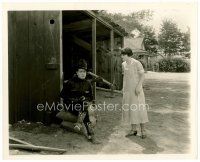 4h293 HOOT GIBSON 8x10 still '20s close up with gun deep in thought as woman watches him!