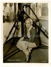 4h596 SALLY EILERS candid 8x10 still '34 close up of the pretty actress sitting on tri-pod on set!