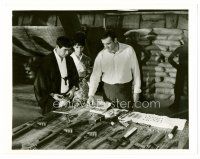4h781 YOU ONLY LIVE TWICE 8x10.25 still '67 Sean Connery as James Bond looks at guns & ammo!