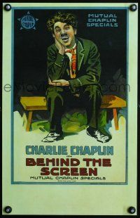 4k155 BEHIND THE SCREEN WC '16 wonderful stone litho of laughing Charlie Chaplin sitting on bench!