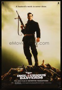 5k362 INGLOURIOUS BASTERDS teaser DS 1sh '09 Quentin Tarantino, Brad Pitt standing on pile of Nazis