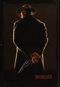 5k769 UNFORGIVEN undated teaser 1sh '92 classic image of gunslinger Clint Eastwood w/back turned!