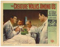 5z173 CREATURE WALKS AMONG US LC #4 '56 four guys examine wounded monster on operating table!