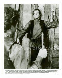 6c570 OCTOPUSSY 8x10 still '83 Roger Moore as James Bond pinned to wall by knife thrower!