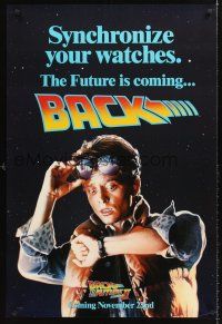 7c029 BACK TO THE FUTURE II teaser DS 1sh '89 art of Michael J. Fox, synchronize your watch!