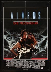 7s074 ALIENS German '86 James Cameron, cool image of Sigourney Weaver w/giant gun & Carrie Henn!