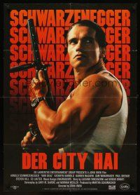 7s251 RAW DEAL German '86 tough guy Arnold Schwarzenegger w/gun!