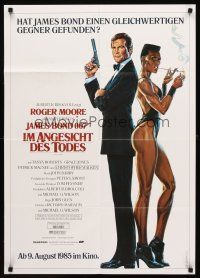 7s298 VIEW TO A KILL advance German '85 art of Roger Moore as Bond & smoking Grace Jones by Goozee!