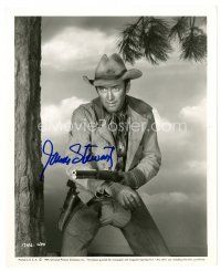 7t317 JAMES STEWART signed 8x10 still '54 full-length pointing rifle from The Far Country!