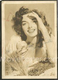 7t419 JANE RUSSELL signed deluxe 5x7 still '40s laying in hay in low-cut blouse, eating an apple!