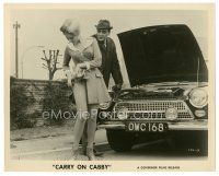 7w249 CARRY ON CABBY 8x10 still 1967 English taxi cab sex, man eyes sexy girl adjusting nylon!