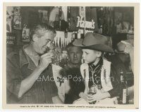 7w095 MISFITS candid 8x10 still '61 director John Huston talks to young cowboy sitting on bar!
