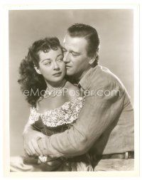 7w742 WAKE OF THE RED WITCH 8x10 still '49 romantic close up of John Wayne holding Gail Russell!