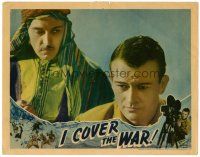 8f569 I COVER THE WAR LC '37 close up of Charles Brokaw eying young newsreel cameraman John Wayne!
