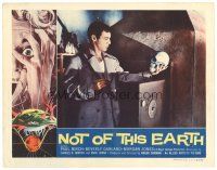 8f699 NOT OF THIS EARTH LC '57 Roger Corman classic, close up of Jonathan Haze examining skull!