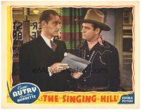 8f840 SINGING HILL LC '41 close up of cowboy Gene Autry being shown papers by George Meeker!