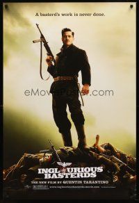 8h365 INGLOURIOUS BASTERDS teaser DS 1sh '09 Quentin Tarantino, Brad Pitt standing on pile of Nazis