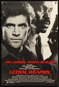 8h420 LETHAL WEAPON 1sh '87 great close image of cop partners Mel Gibson & Danny Glover!