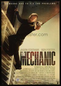 8h457 MECHANIC int'l 1sh '11 cool image of Jason Statham in harness w/gun!