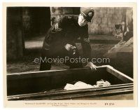 8j279 DRACULA'S DAUGHTER 8x10 still R49 cop with flashlight standing over dead body in coffin!