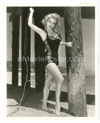 8j668 MONICA LEWIS deluxe 8x10 still '52 full-length in sexy swimsuit under pier whipping seaweed!