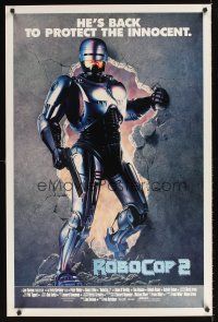 8z614 ROBOCOP 2 int'l 1sh '90 cyborg policeman Peter Weller busts through wall, scii-fi sequel!