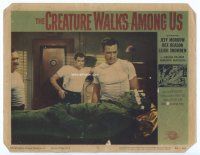 9d330 CREATURE WALKS AMONG US LC #8 '56 three guys watch wounded monster laying on table!