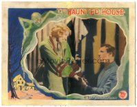 9d461 HAUNTED HOUSE LC '28 Thelma Todd holding hands with man, great border artwork of ghost!