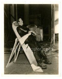 9r130 BRIDE OF FRANKENSTEIN candid 8x10 still '35 Boris Karloff resting on platform in costume!